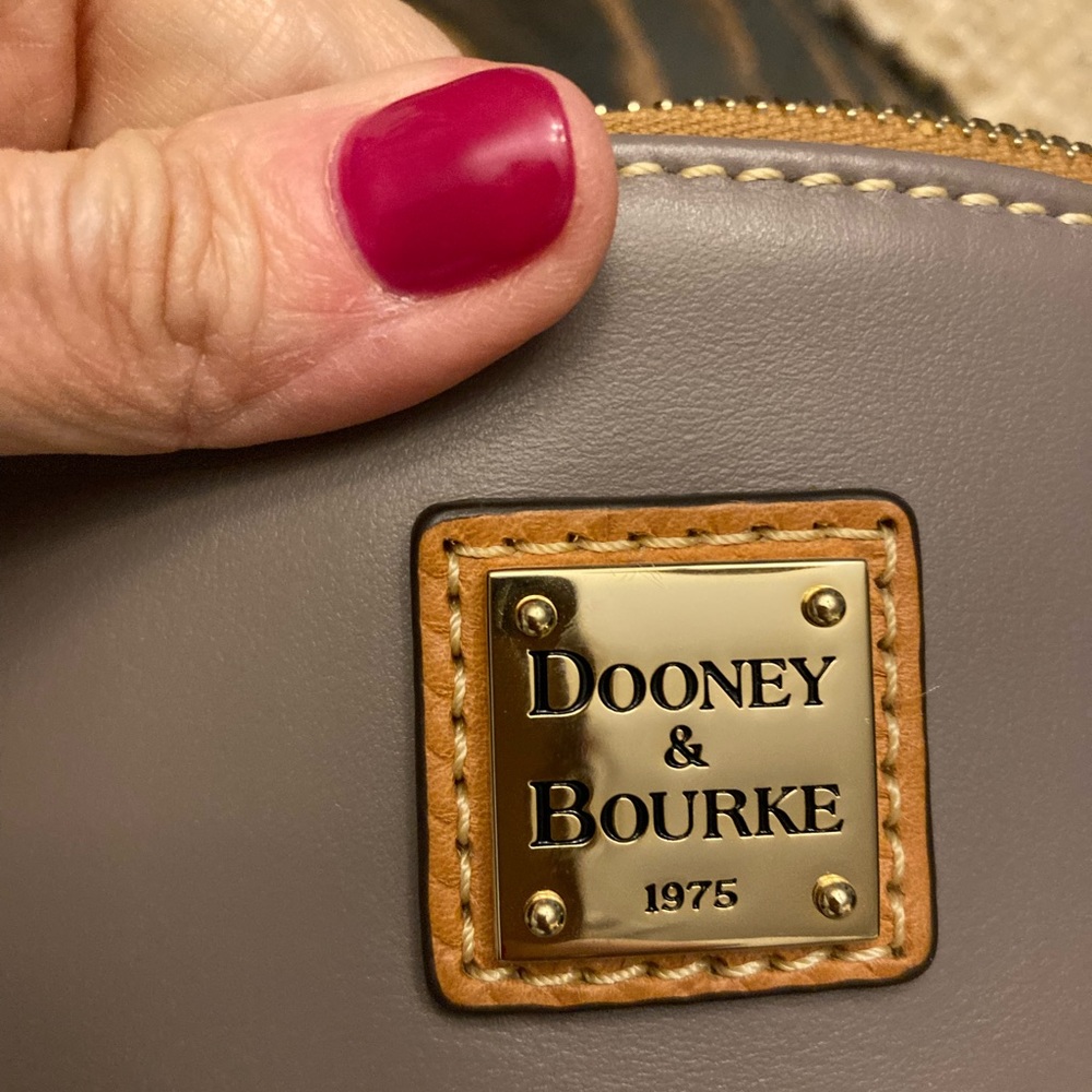 Brand new Dooney bag never carried.
